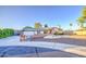 Charming single story home featuring a spacious driveway, two-car garage, and brick accents at 3906 W Aire Libre Ave, Phoenix, AZ 85053
