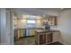 Kitchen with tile floors, light wood cabinets, and stainless steel appliances at 3906 W Aire Libre Ave, Phoenix, AZ 85053