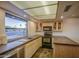 Bright kitchen features stainless steel appliances and a window over the sink at 3906 W Aire Libre Ave, Phoenix, AZ 85053