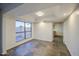 Living room featuring large windows and tile flooring at 3906 W Aire Libre Ave, Phoenix, AZ 85053
