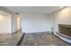 Living room featuring stylish tile flooring, an iron fireplace, and an abundance of natural light at 3906 W Aire Libre Ave, Phoenix, AZ 85053