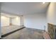 Living room featuring stylish tile flooring, an iron fireplace, and an abundance of natural light at 3906 W Aire Libre Ave, Phoenix, AZ 85053