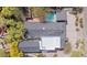 Beautiful property with a swimming pool, mature trees, lush landscaping, and a well-maintained roof at 4035 E Mcdonald Dr, Phoenix, AZ 85018