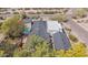 Expansive property includes a refreshing pool, privacy fence, and lush landscaping, perfect for outdoor living at 4035 E Mcdonald Dr, Phoenix, AZ 85018