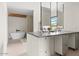 Modern bathroom featuring dual vanities, floating mirrors, and soaking tub at 4035 E Mcdonald Dr, Phoenix, AZ 85018