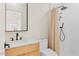Modern bathroom with wood vanity, marble countertop, and tiled shower at 4035 E Mcdonald Dr, Phoenix, AZ 85018