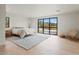 Bright bedroom featuring a large window with natural light and light wood floors at 4035 E Mcdonald Dr, Phoenix, AZ 85018