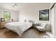 Bright bedroom featuring a comfortable bed, modern furnishings, and natural light at 4035 E Mcdonald Dr, Phoenix, AZ 85018