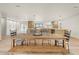 Open-concept dining and kitchen area, perfect for Gathering gatherings, featuring modern lighting and hardwood floors at 4035 E Mcdonald Dr, Phoenix, AZ 85018