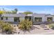 Beautiful modern home with desert landscaping, a clean design, and dark frame windows at 4035 E Mcdonald Dr, Phoenix, AZ 85018