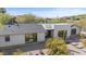 Beautifully landscaped modern home featuring clean lines, desert landscaping and large black frame windows at 4035 E Mcdonald Dr, Phoenix, AZ 85018