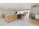 Bright, open kitchen with dual islands, bar stool seating and hardwood floors at 4035 E Mcdonald Dr, Phoenix, AZ 85018