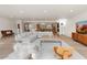 Inviting open-concept living space featuring stylish furniture, hardwood floors, and seamless flow to the kitchen at 4035 E Mcdonald Dr, Phoenix, AZ 85018