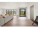 Bright living room with hardwood floors, large windows, and stylish neutral furniture creating a welcoming atmosphere at 4035 E Mcdonald Dr, Phoenix, AZ 85018
