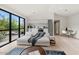 Bright open living space with modern decor, kitchen, and access to the home's private backyard at 4035 E Mcdonald Dr, Phoenix, AZ 85018