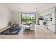 Open living space with modern decor, white sofa, and bright natural light at 4035 E Mcdonald Dr, Phoenix, AZ 85018