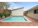 Inviting backyard pool with brick patio, ideal for relaxation and outdoor entertainment at 4035 E Mcdonald Dr, Phoenix, AZ 85018