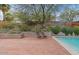 Relaxing backyard with brick patio surrounding a refreshing pool, perfect for outdoor enjoyment at 4035 E Mcdonald Dr, Phoenix, AZ 85018