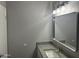 Bathroom features a framed mirror, vanity with granite countertop, and modern lighting at 4701 N 39Th Dr, Phoenix, AZ 85019