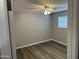 Bedroom boasts wood-look flooring, a modern ceiling fan, and neutral, light gray paint at 4701 N 39Th Dr, Phoenix, AZ 85019