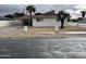 Charming single-story home featuring a palm tree and a covered parking area at 4701 N 39Th Dr, Phoenix, AZ 85019