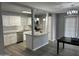 Modern kitchen boasts stainless appliances, white cabinets, and an adjacent dining area at 4701 N 39Th Dr, Phoenix, AZ 85019