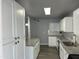Well-lit kitchen featuring a large island, white cabinets, and stainless steel appliances at 4701 N 39Th Dr, Phoenix, AZ 85019