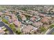 Picturesque aerial view of a vibrant community with terracotta roofed homes and lush landscaping, offering a serene living environment at 4777 S Fulton Ranch Blvd # 1050, Chandler, AZ 85248