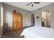 Bright bedroom featuring a large wardrobe, ceiling fan, and access to a patio at 4777 S Fulton Ranch Blvd # 1050, Chandler, AZ 85248