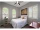 Cozy bedroom with shuttered windows, ceiling fan, and decor art at 4777 S Fulton Ranch Blvd # 1050, Chandler, AZ 85248