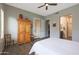 Comfortable bedroom with wood-look tile flooring, a ceiling fan, and neutral paint at 4777 S Fulton Ranch Blvd # 1050, Chandler, AZ 85248