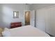Bedroom featuring a view to hallway, closet with doors, and a small dresser at 4777 S Fulton Ranch Blvd # 1050, Chandler, AZ 85248