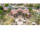 Community center features a grand pergola entrance, circular driveway, and meticulously manicured landscaping at 4777 S Fulton Ranch Blvd # 1050, Chandler, AZ 85248