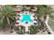 Aerial view of a resort-style community pool featuring lounge chairs, covered cabanas, and meticulous landscaping at 4777 S Fulton Ranch Blvd # 1050, Chandler, AZ 85248