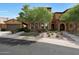 Beautiful home exterior featuring stone accents, a tiled roof, and well-maintained landscaping at 4777 S Fulton Ranch Blvd # 1050, Chandler, AZ 85248