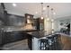 Contemporary kitchen with dark cabinets, granite countertops, and stainless steel appliances at 4777 S Fulton Ranch Blvd # 1050, Chandler, AZ 85248