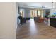 Open-concept living and dining area with wicker chair and view to outdoor patio at 4777 S Fulton Ranch Blvd # 1050, Chandler, AZ 85248