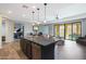 Spacious kitchen island with view into living area and outdoor patio at 4777 S Fulton Ranch Blvd # 1050, Chandler, AZ 85248