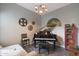 Cozy living room with piano, stylish chandelier, and charming movie reel wall decor at 4777 S Fulton Ranch Blvd # 1050, Chandler, AZ 85248