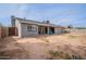 Backyard with patio, string lights, and gray brick exterior at 514 E Barrus Pl, Casa Grande, AZ 85122