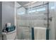 Bathroom features a newly remodeled shower with glass doors and a decorative design at 514 E Barrus Pl, Casa Grande, AZ 85122
