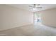 Large bedroom with new carpet and a sliding glass door to enjoy the outdoors at 514 E Barrus Pl, Casa Grande, AZ 85122