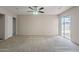 Spacious bedroom boasts new carpet, ceiling fan, sliding door to patio and closet at 514 E Barrus Pl, Casa Grande, AZ 85122
