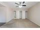 Bedroom boasts carpet, ceiling fan, closet and ensuite bathroom at 514 E Barrus Pl, Casa Grande, AZ 85122