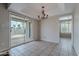 Dining room with tile flooring, a chandelier, and access to the backyard patio at 514 E Barrus Pl, Casa Grande, AZ 85122