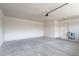 This spacious two car garage features concrete flooring and white painted walls at 514 E Barrus Pl, Casa Grande, AZ 85122