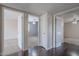 Hallway provides access to bedrooms, featuring neutral paint and modern lighting at 514 E Barrus Pl, Casa Grande, AZ 85122