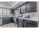 Updated kitchen with stainless steel appliances and tiled backsplash at 514 E Barrus Pl, Casa Grande, AZ 85122