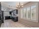 Bright kitchen with dark cabinetry, tile flooring and white countertops at 514 E Barrus Pl, Casa Grande, AZ 85122