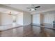 Open living space with tile flooring, hardwood flooring, and a chandelier in the background at 514 E Barrus Pl, Casa Grande, AZ 85122